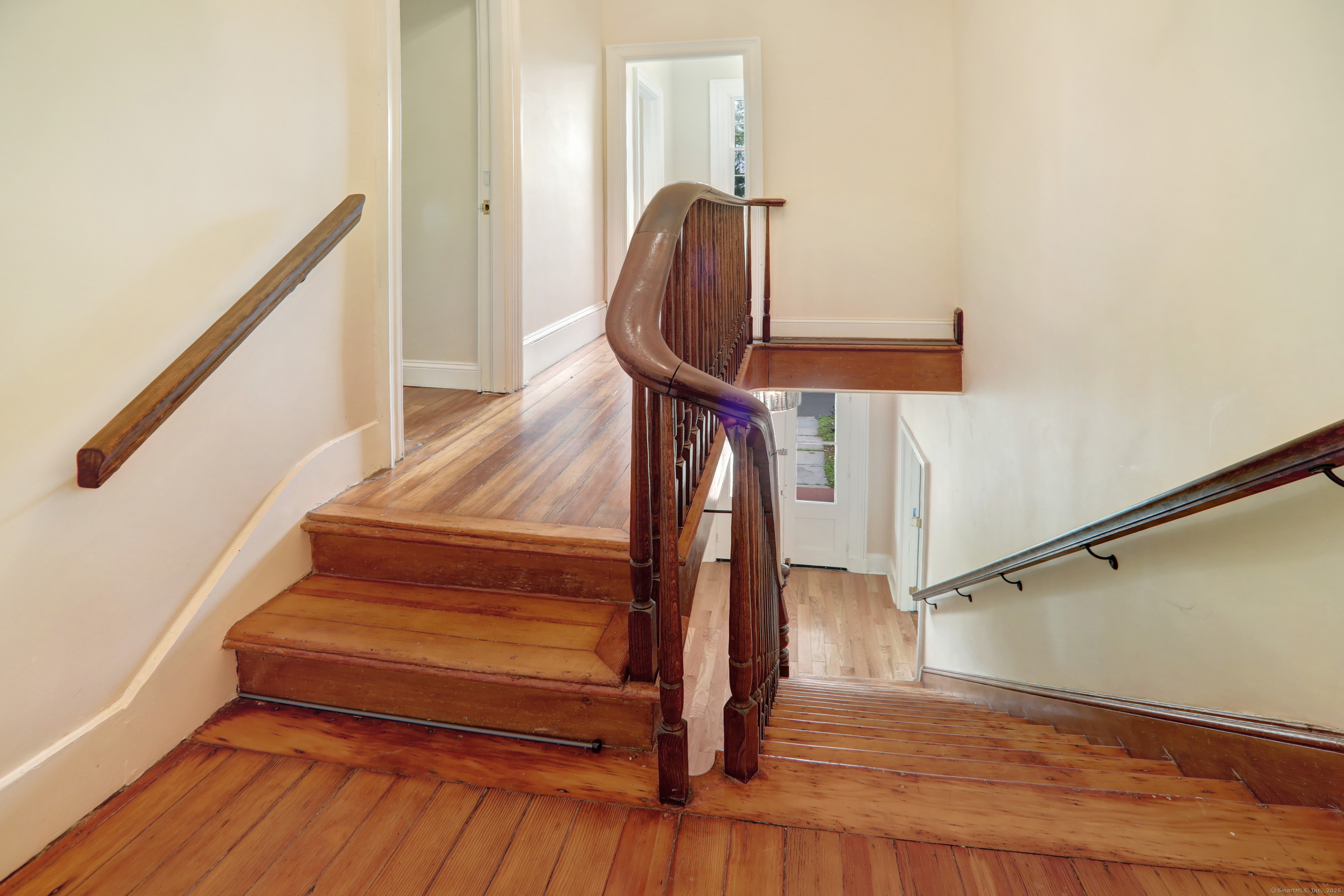 a view of entryway with wooden floor