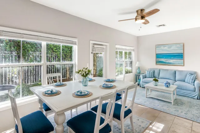 a room with stainless steel appliances a refrigerator and cabinets