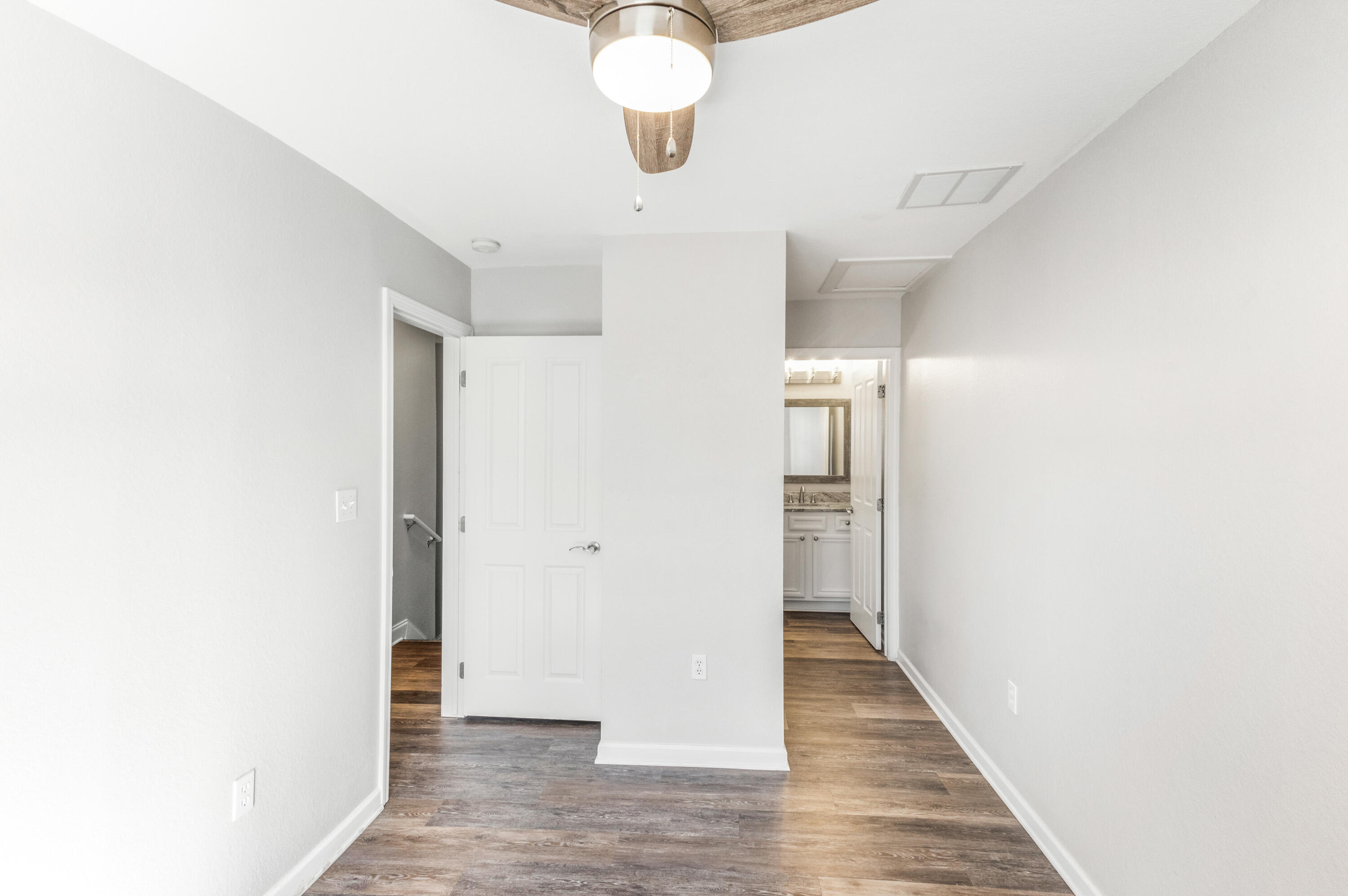 24 Talon Court, Unit C Santa Rosa Beach, FL 32459 - Photo 20 of 29 a view of a hallway with wooden floor