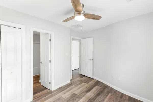 a view of room with window and wooden floor