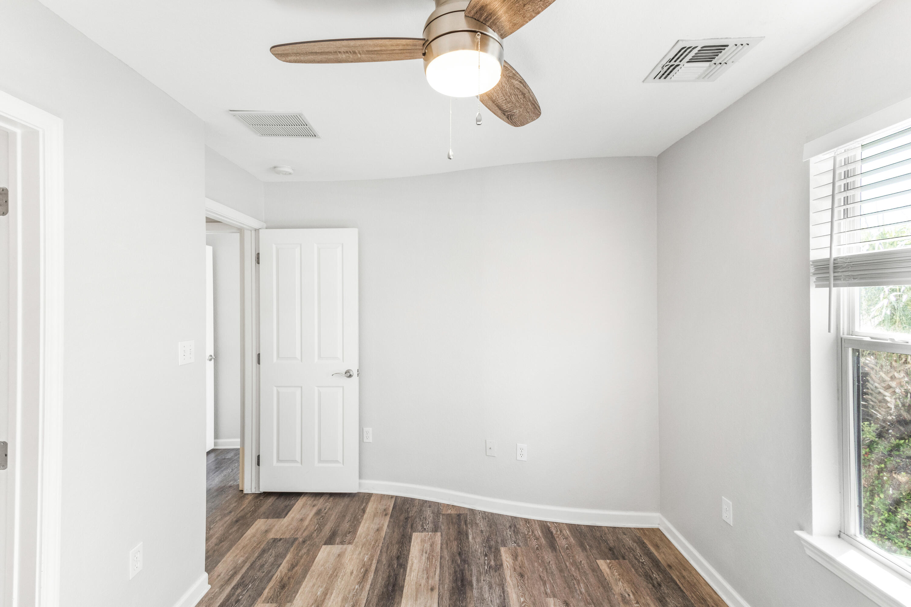 24 Talon Court, Unit C Santa Rosa Beach, FL 32459 - Photo 24 of 29 a view of room with window and wooden floor