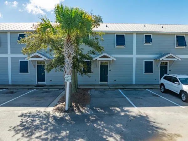 a view of a car park in front of a house