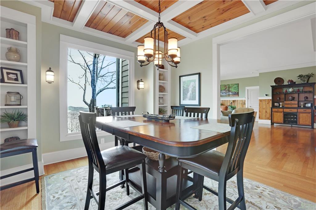 79 Strawberry Way Jasper, GA 30143 - Photo 15 of 67 a view of a dining room with furniture wooden floor and chandelier