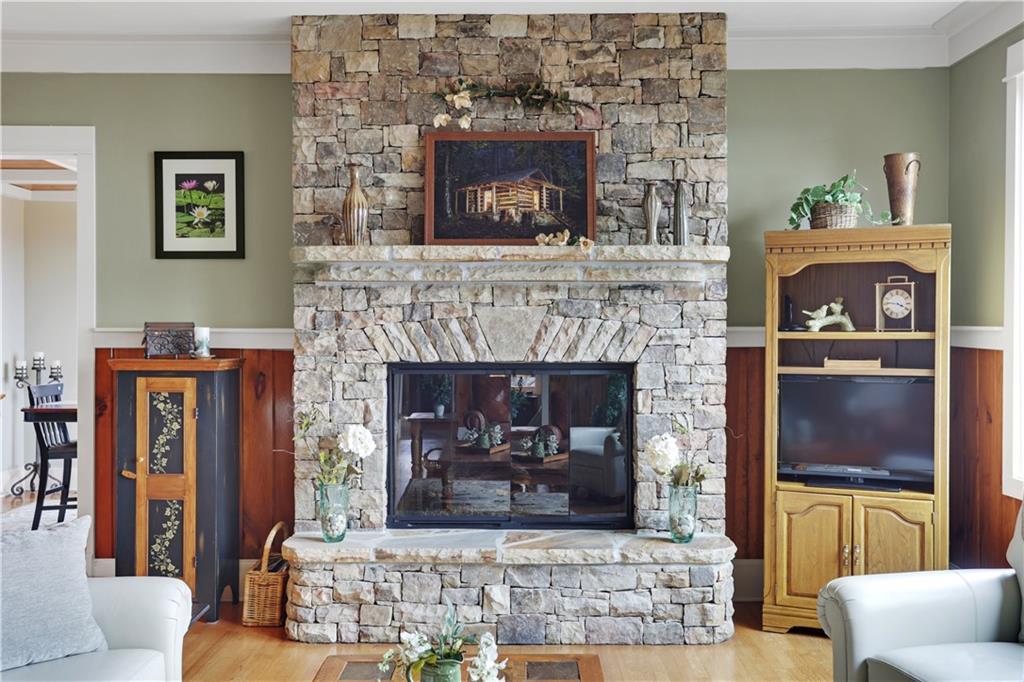 79 Strawberry Way Jasper, GA 30143 - Photo 17 of 67 a living room with furniture and a fireplace