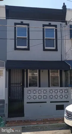 a view of a house with a door and a window