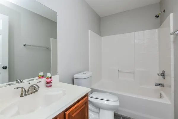 a bathroom with a sink a toilet and a bathtub