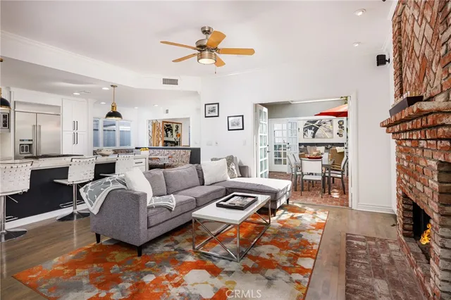 a living room with furniture a rug and a chandelier
