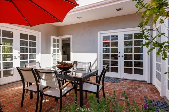 a view of a dining room with furniture and front door
