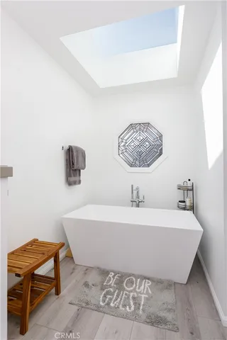 a bathroom with a bathtub and a