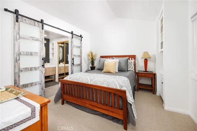 a bed room with a bed and a window