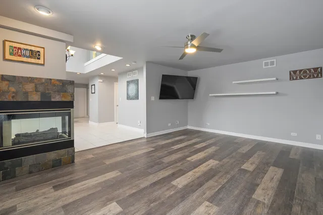 a view of an empty room fire place and a fireplace