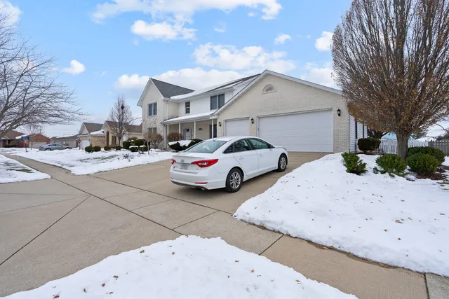 a couple of cars parked in front of house