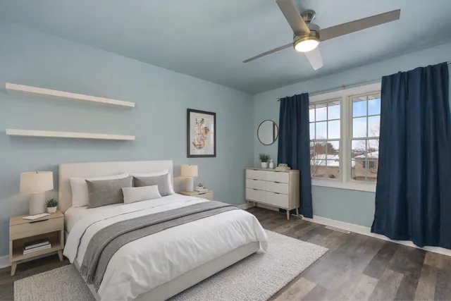 a bedroom with a large bed and a window