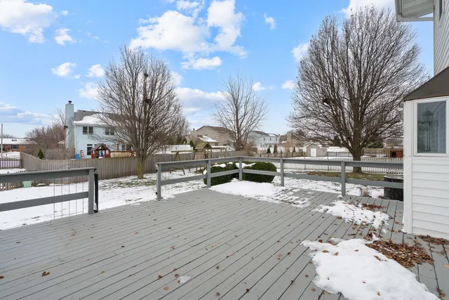 a view of a house with a snow in the yard