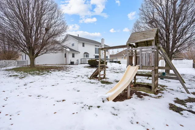 a view of a yard covered in snow