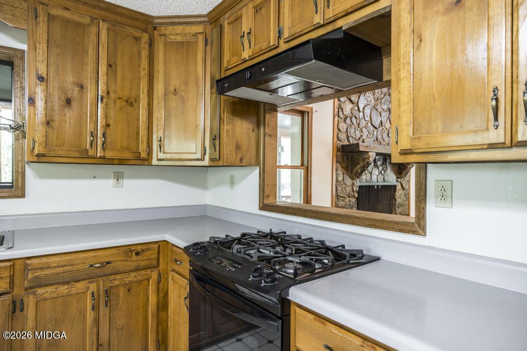 194 Delone Road Byron, GA 31008 - Photo 17 of 49 a kitchen with a stove and a window