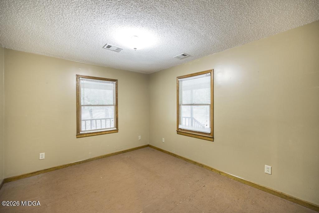 194 Delone Road Byron, GA 31008 - Photo 24 of 49 an empty room with a window