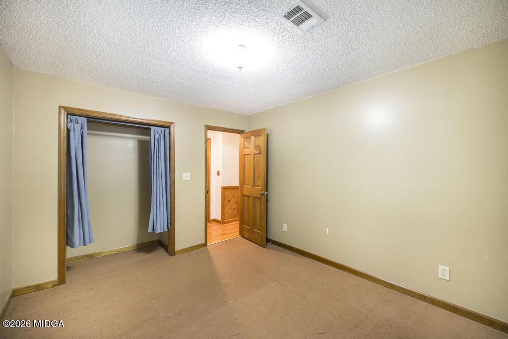 194 Delone Road Byron, GA 31008 - Photo 25 of 49 an empty room with closet area