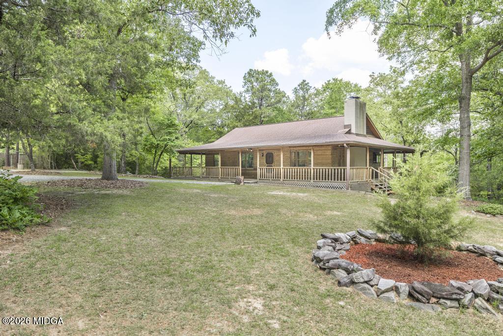 194 Delone Road Byron, GA 31008 - Photo 3 of 49 a front view of a house with garden