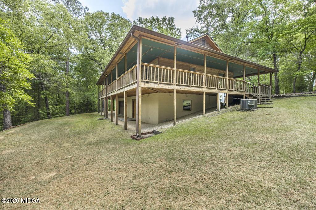 194 Delone Road Byron, GA 31008 - Photo 33 of 49 a house with trees in front of it