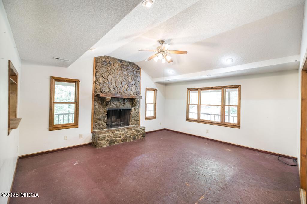 194 Delone Road Byron, GA 31008 - Photo 10 of 49 an empty room with windows and fireplace