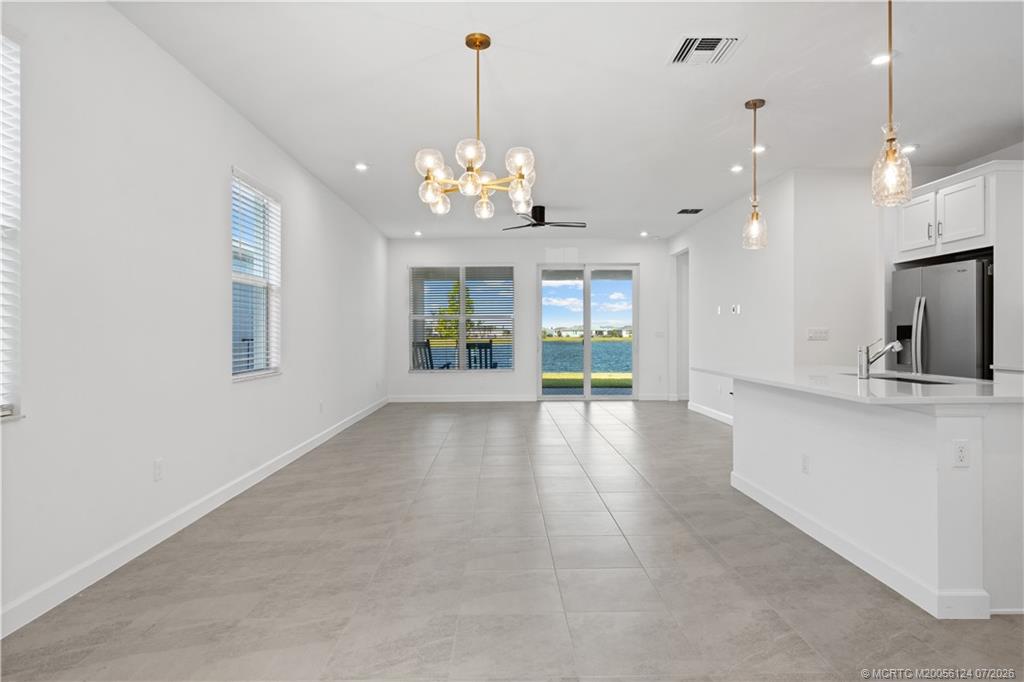 9731 Southwest Indra Way Port St. Lucie, FL 34987 - Photo 4 of 33 Kitchen/ Living/ Dining