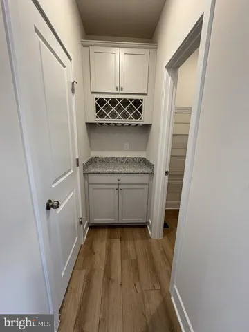 a bathroom with a sink a toilet a shower and vanity