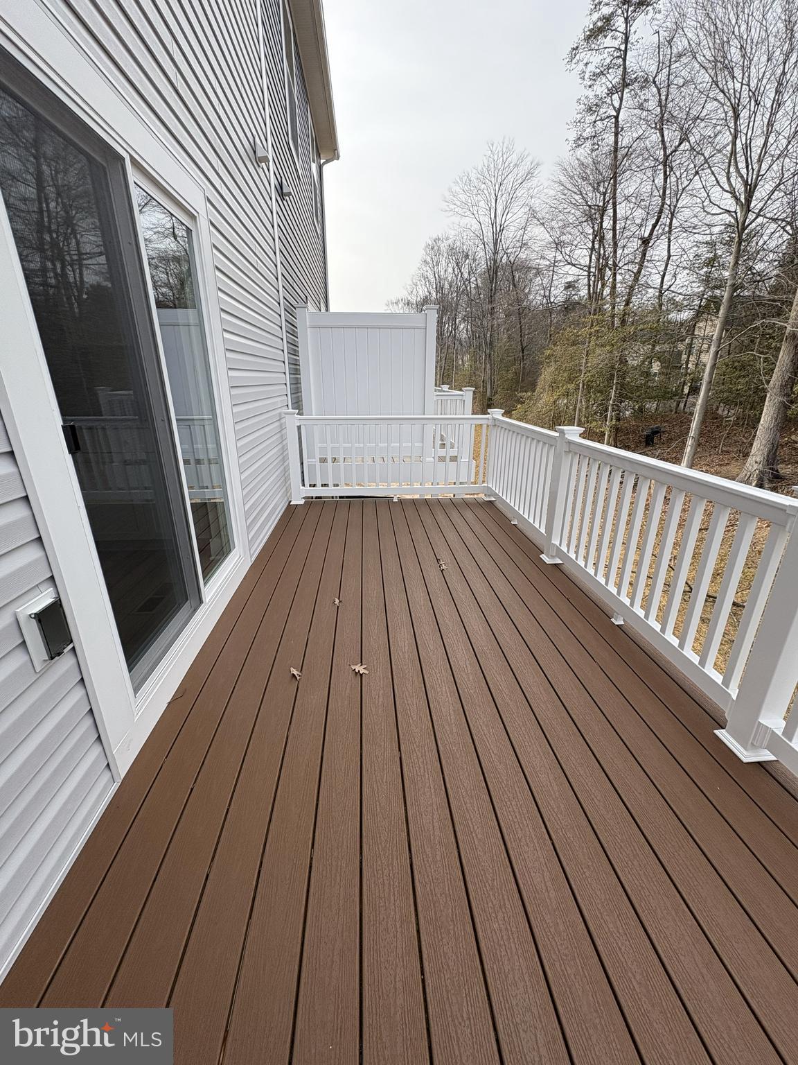 7448 Cornerstone Way Laurel, MD 20707 - Photo 6 of 13 a view of deck with wooden floor and fence next to a yard