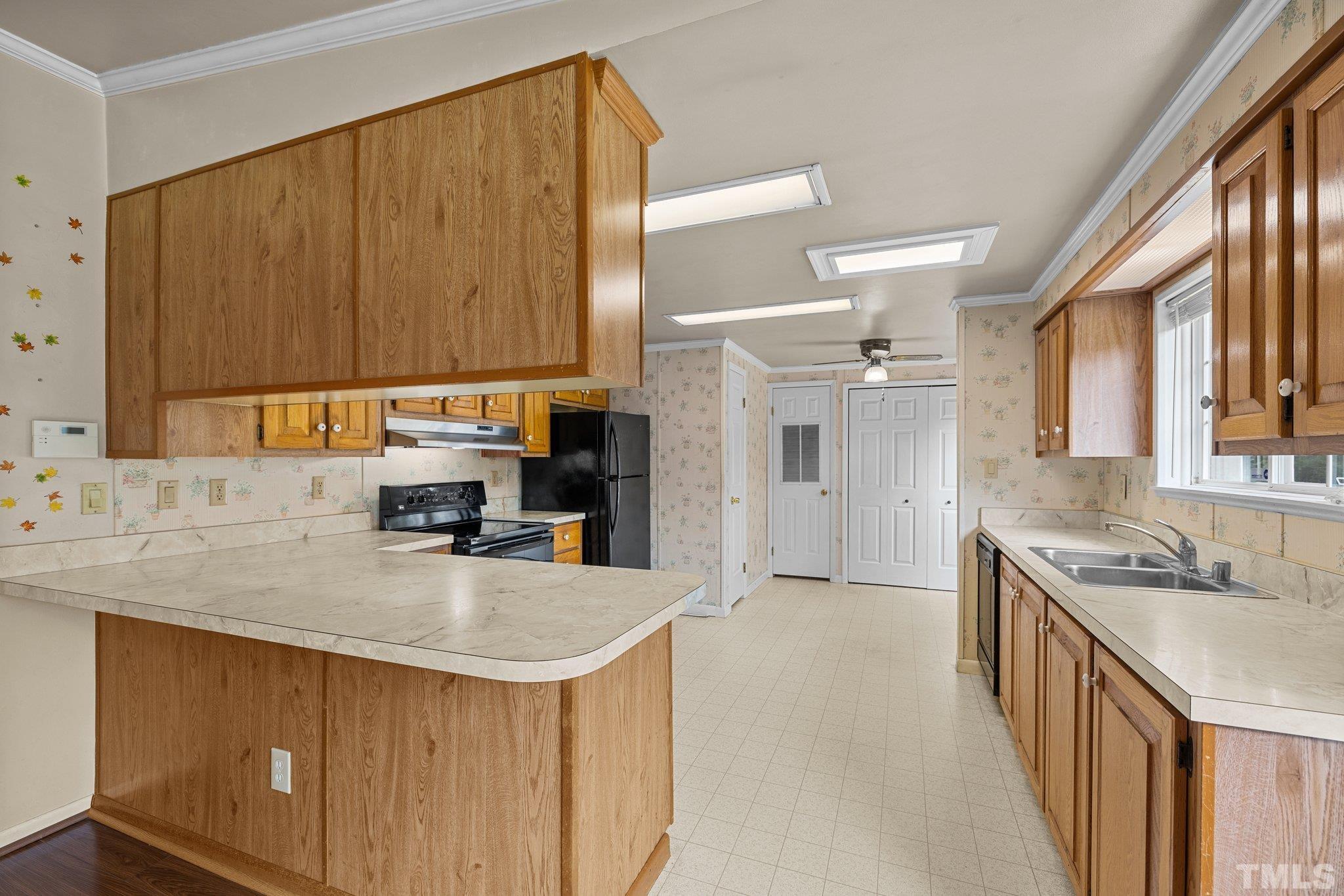 4505 Guess Road Rougemont, NC 27572 - Photo 12 of 33 a kitchen with kitchen island granite countertop a sink stove and cabinets