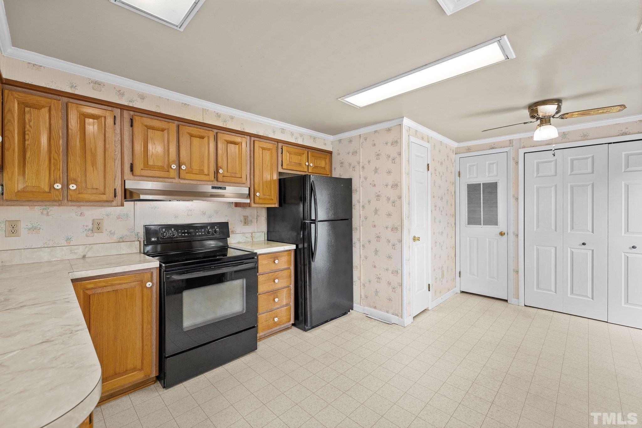 4505 Guess Road Rougemont, NC 27572 - Photo 13 of 33 a kitchen with stainless steel appliances granite countertop a refrigerator stove and sink