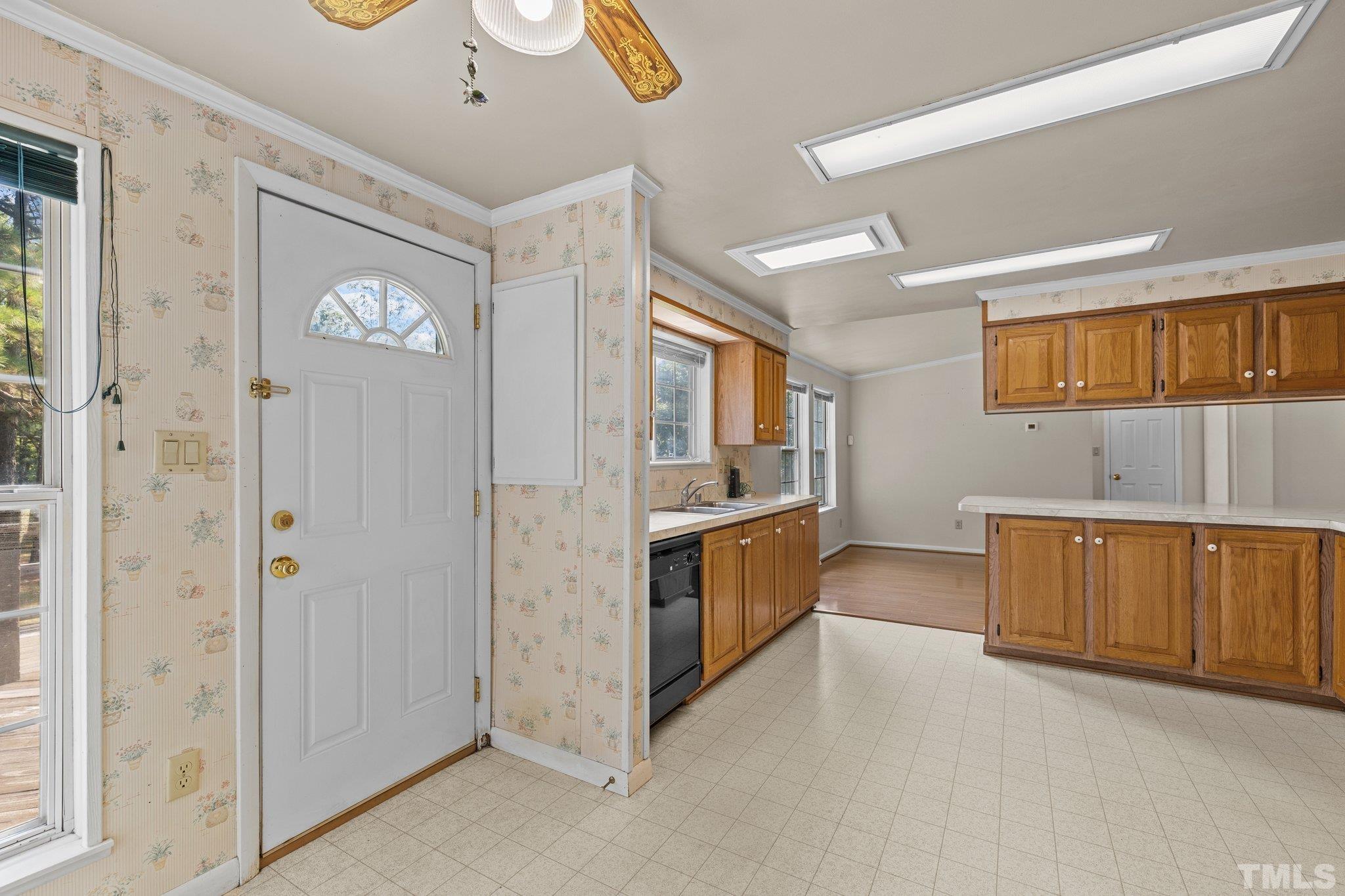 4505 Guess Road Rougemont, NC 27572 - Photo 17 of 33 a large kitchen with stainless steel appliances granite countertop a lot of cabinets and wooden floor