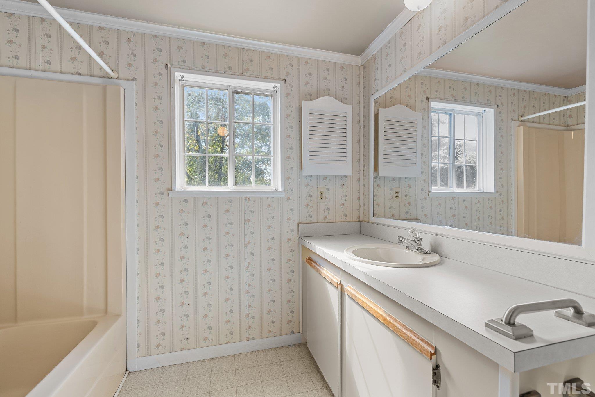 4505 Guess Road Rougemont, NC 27572 - Photo 22 of 33 a bathroom with a sink and a bathtub