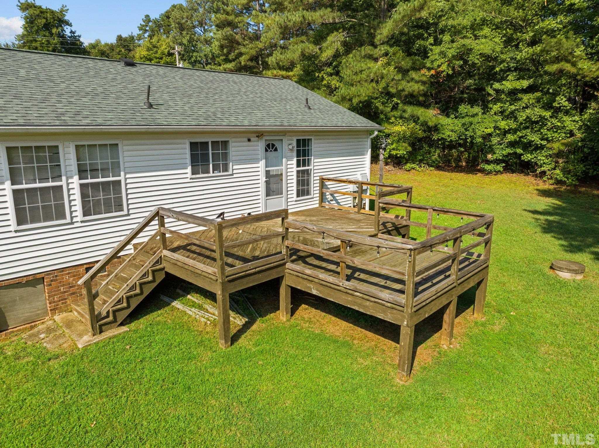 4505 Guess Road Rougemont, NC 27572 - Photo 26 of 33 a view of a house with a backyard and sitting area