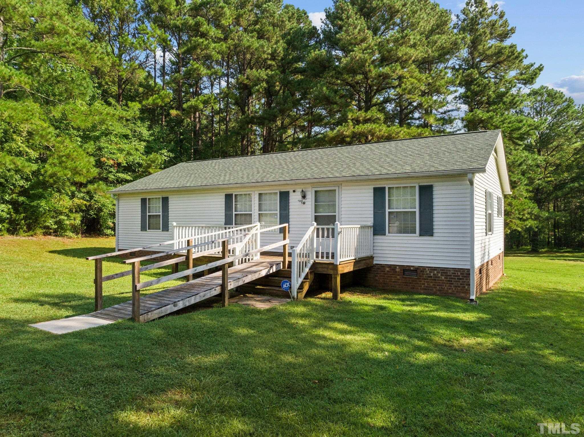4505 Guess Road Rougemont, NC 27572 - Photo 31 of 33 a view of a house with a yard and sitting area