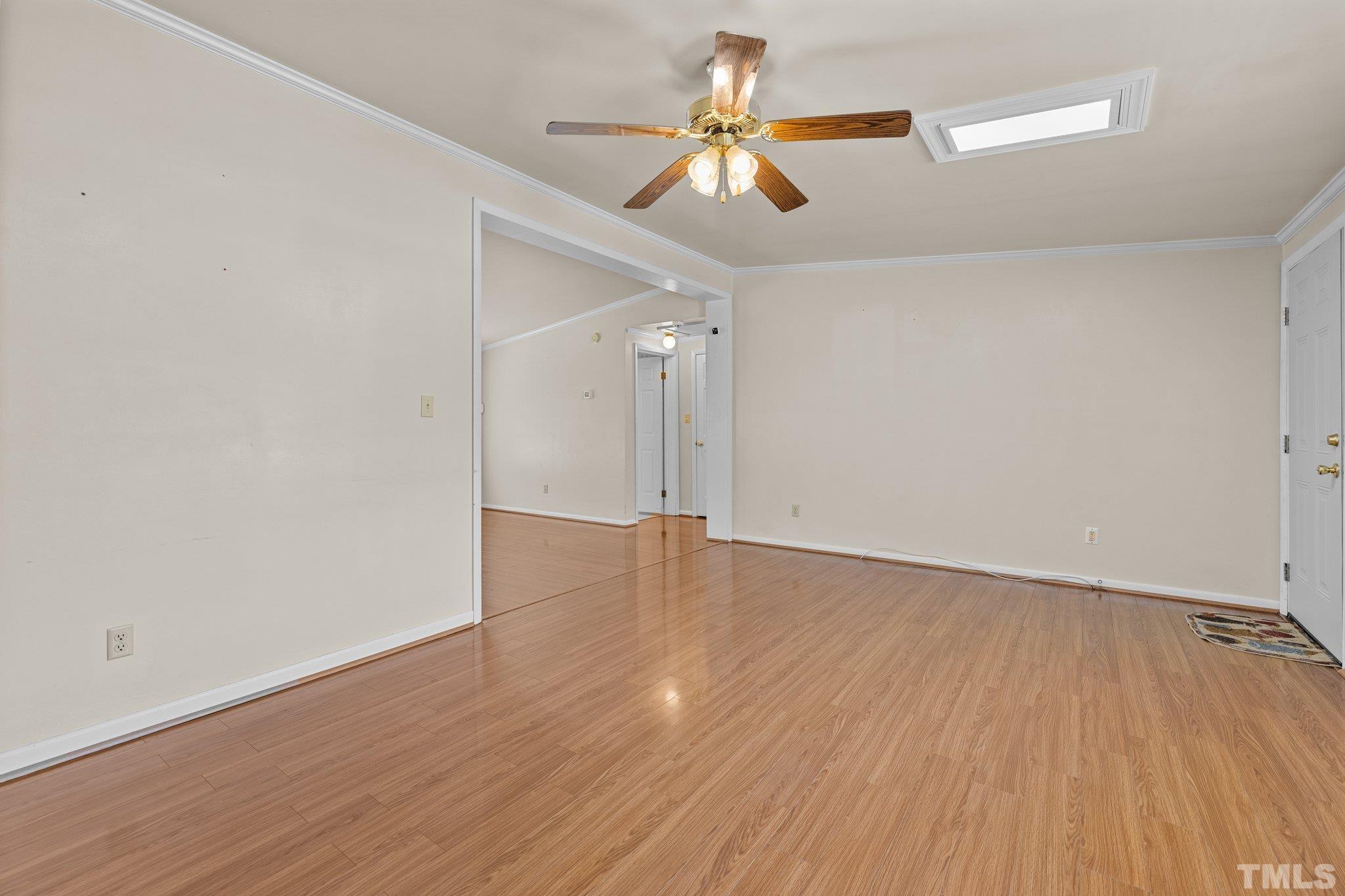 4505 Guess Road Rougemont, NC 27572 - Photo 8 of 33 an empty room with wooden floor and windows