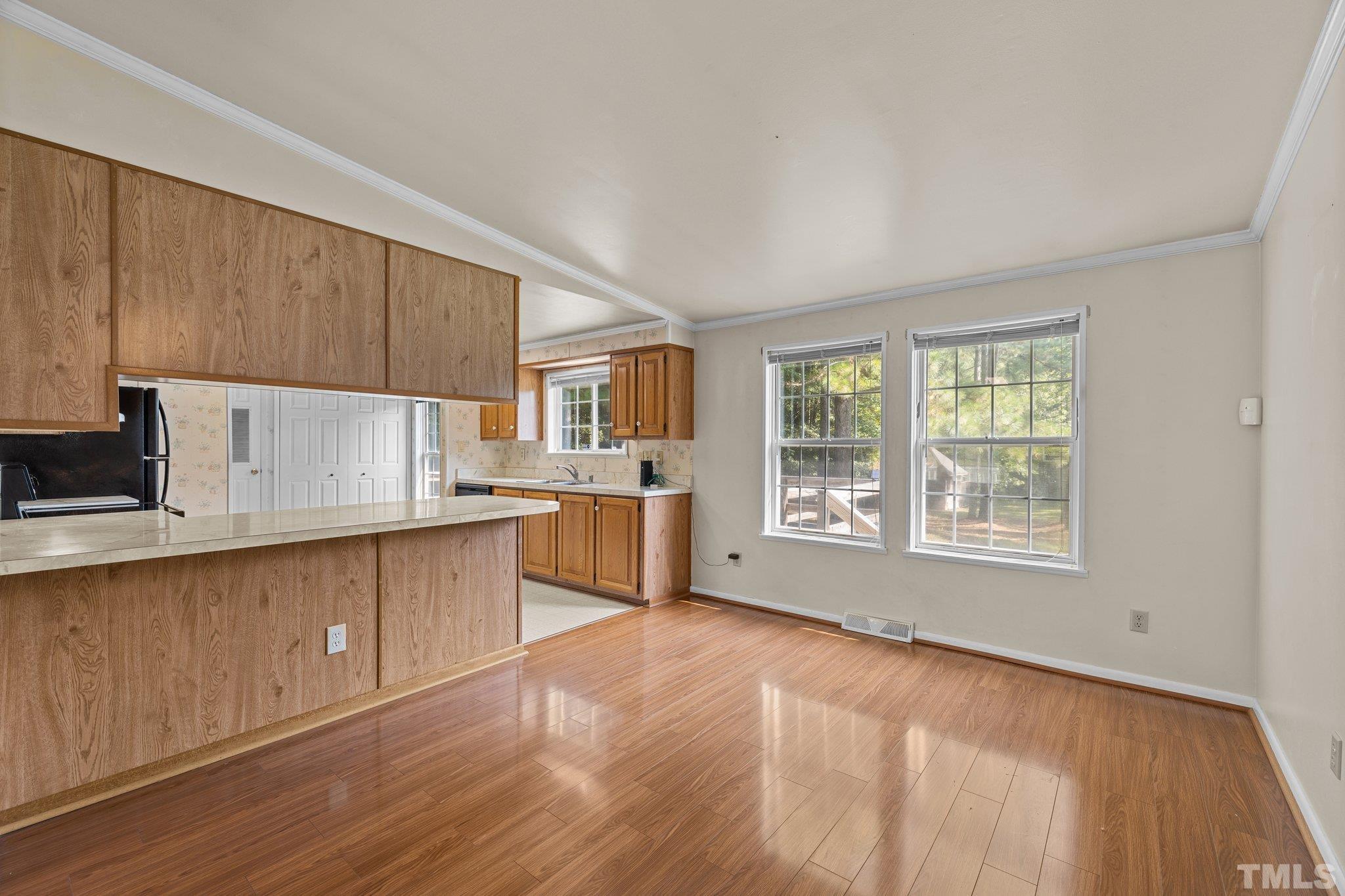 4505 Guess Road Rougemont, NC 27572 - Photo 9 of 33 a open kitchen with cabinets wooden floor and a window
