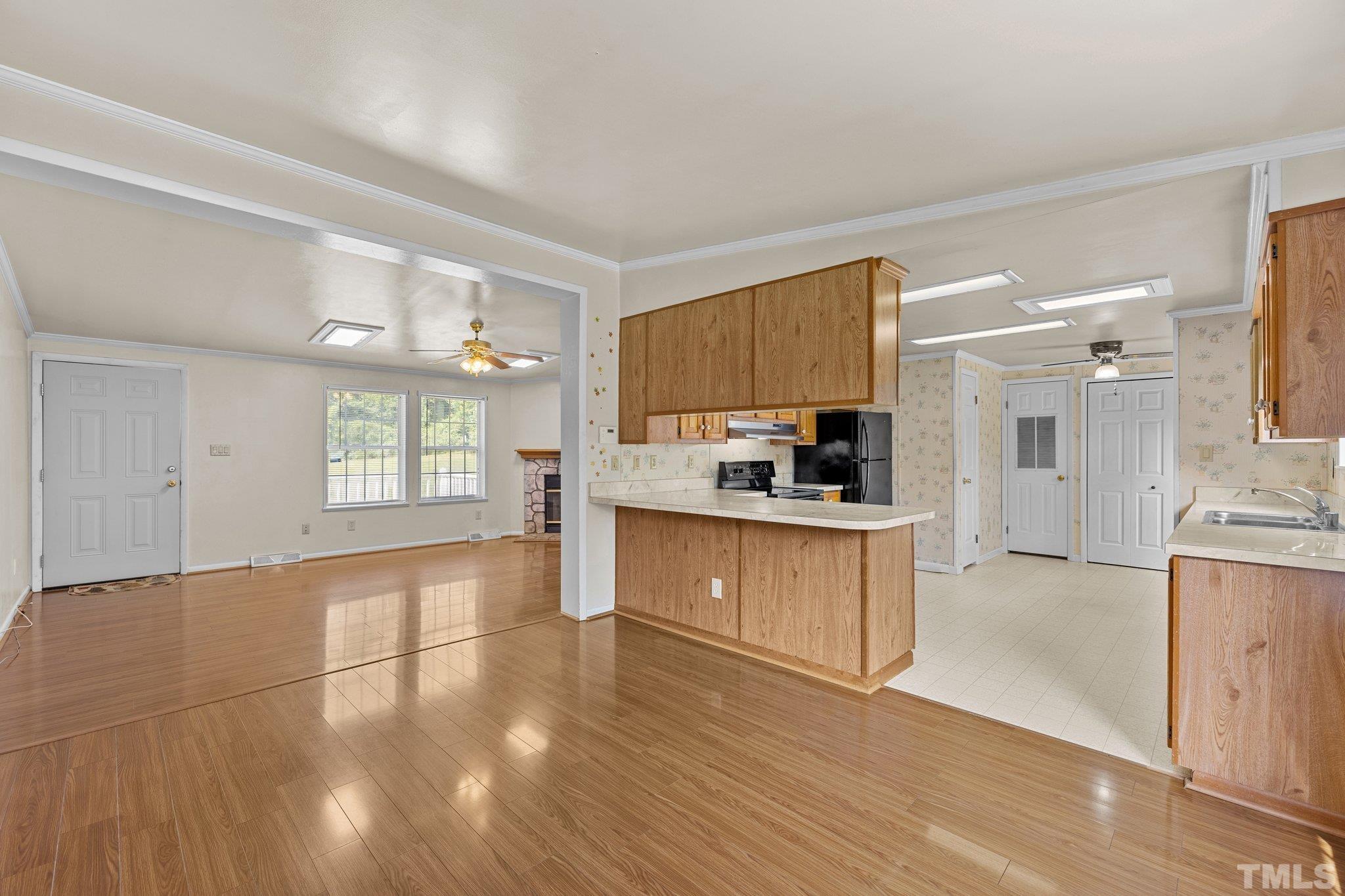 4505 Guess Road Rougemont, NC 27572 - Photo 10 of 33 a kitchen with stainless steel appliances a refrigerator sink and cabinets