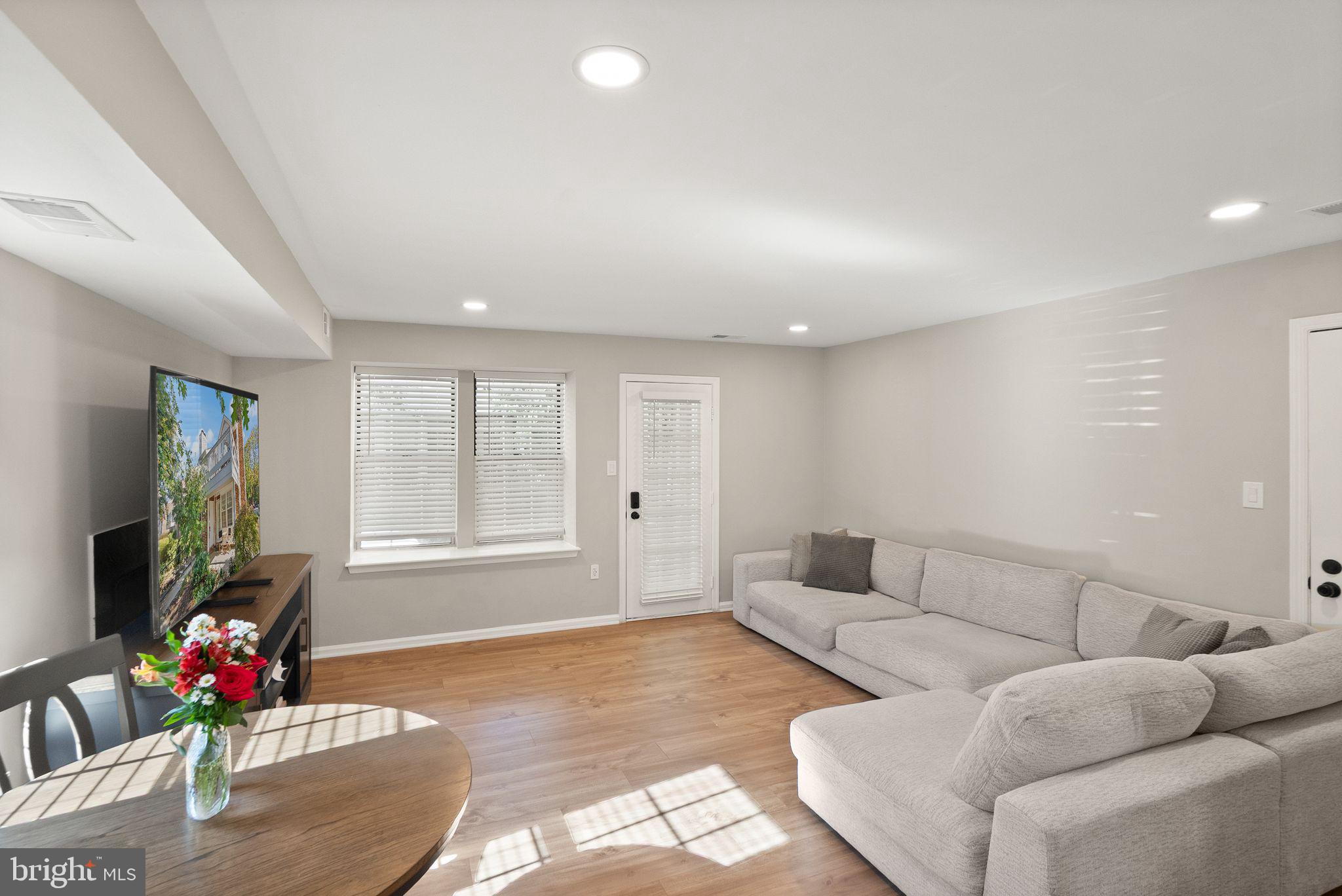 2592 South Arlington Mill Drive, Unit 7 Arlington, VA 22206 - Photo 12 of 44 a living room with furniture and a flat screen tv