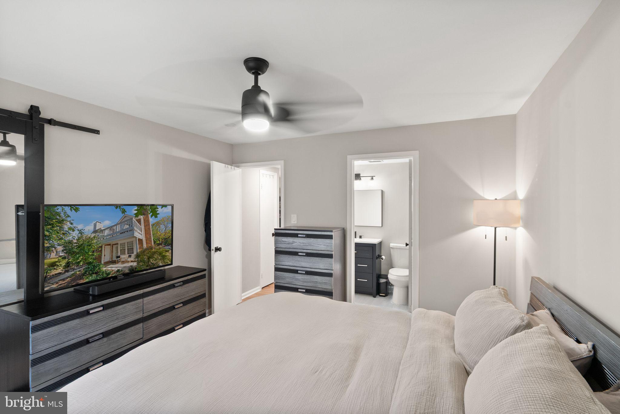 2592 South Arlington Mill Drive, Unit 7 Arlington, VA 22206 - Photo 19 of 44 a bedroom with furniture and a flat screen tv