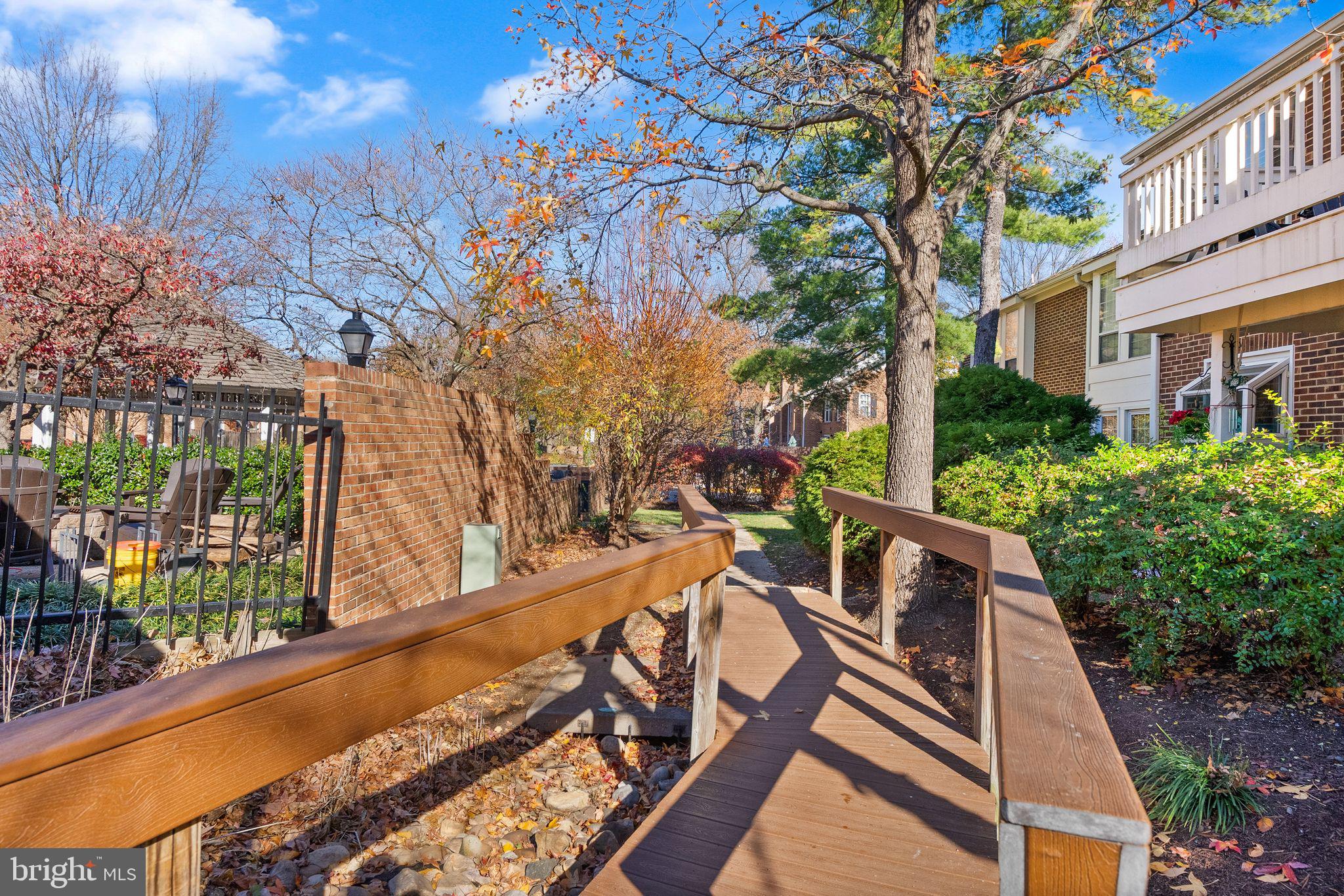 2592 South Arlington Mill Drive, Unit 7 Arlington, VA 22206 - Photo 25 of 44 a view of an house with backyard and trees