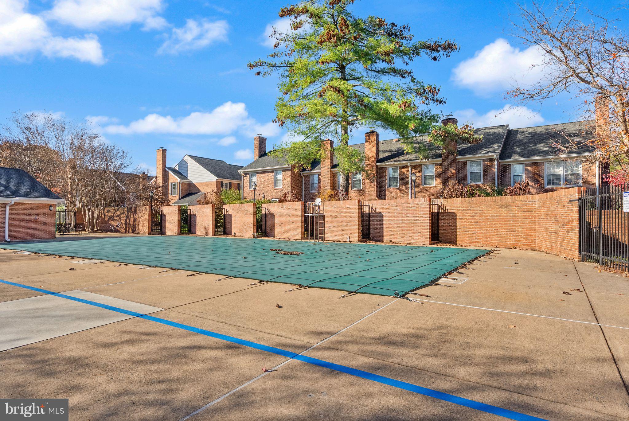 2592 South Arlington Mill Drive, Unit 7 Arlington, VA 22206 - Photo 29 of 44 a front view of a house with a yard and garage
