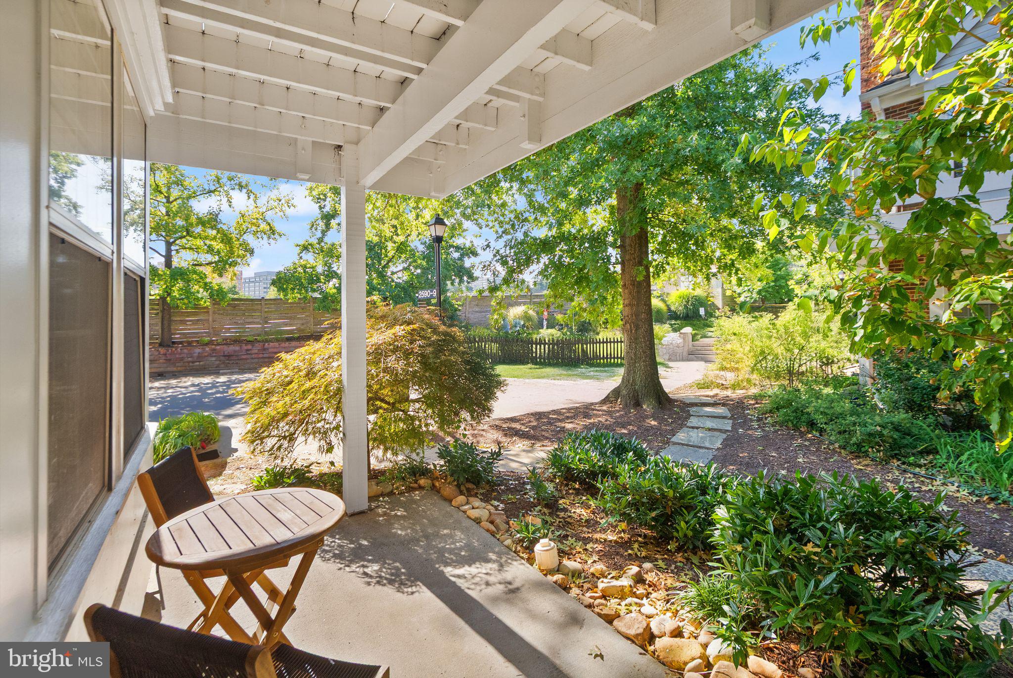 2592 South Arlington Mill Drive, Unit 7 Arlington, VA 22206 - Photo 7 of 44 a view of a porch with furniture and a yard