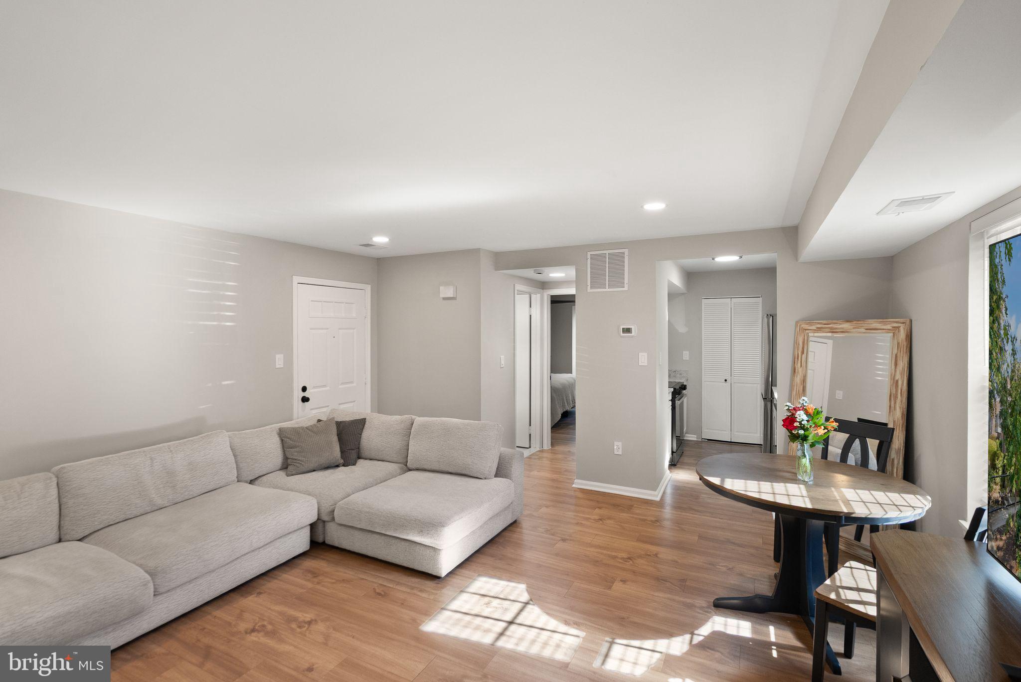2592 South Arlington Mill Drive, Unit 7 Arlington, VA 22206 - Photo 10 of 44 a living room with furniture and a table