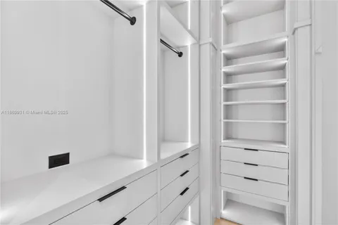 a bathroom with a shower sink and mirror