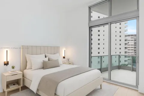 a view of a balcony with floor to ceiling windows