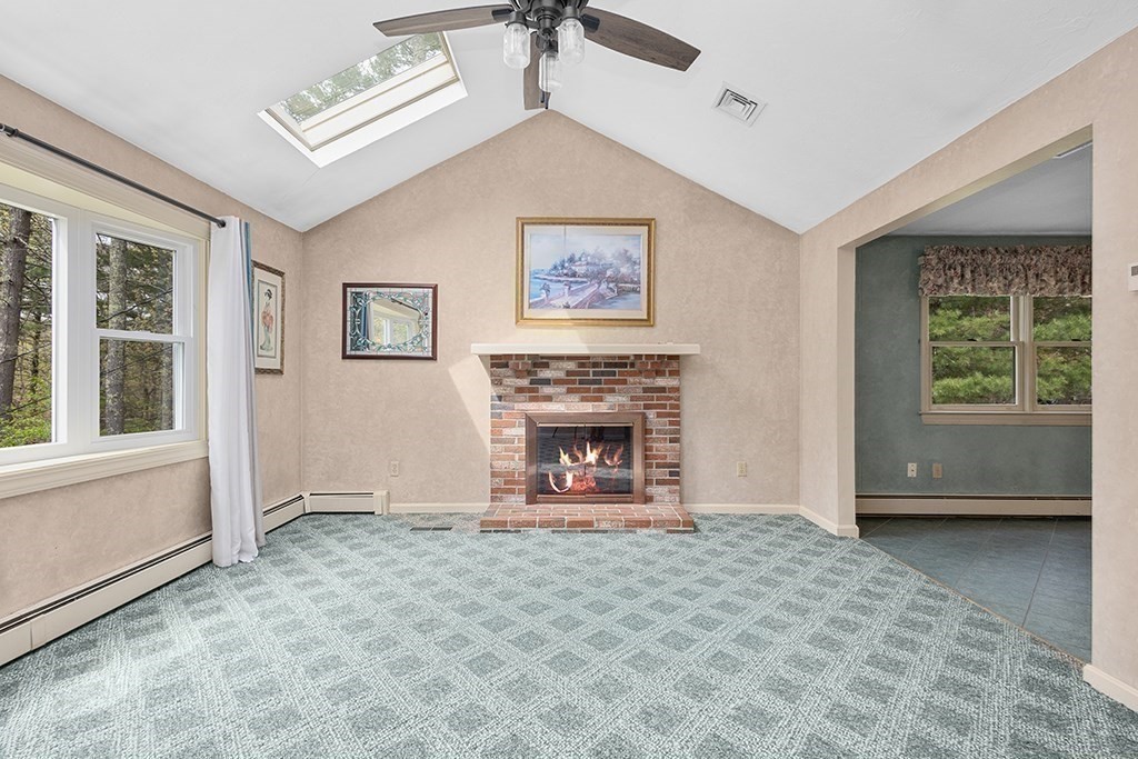 56 Leland Road Norfolk, MA 02056 - Photo 14 of 28 a view of an empty room with a window and fireplace