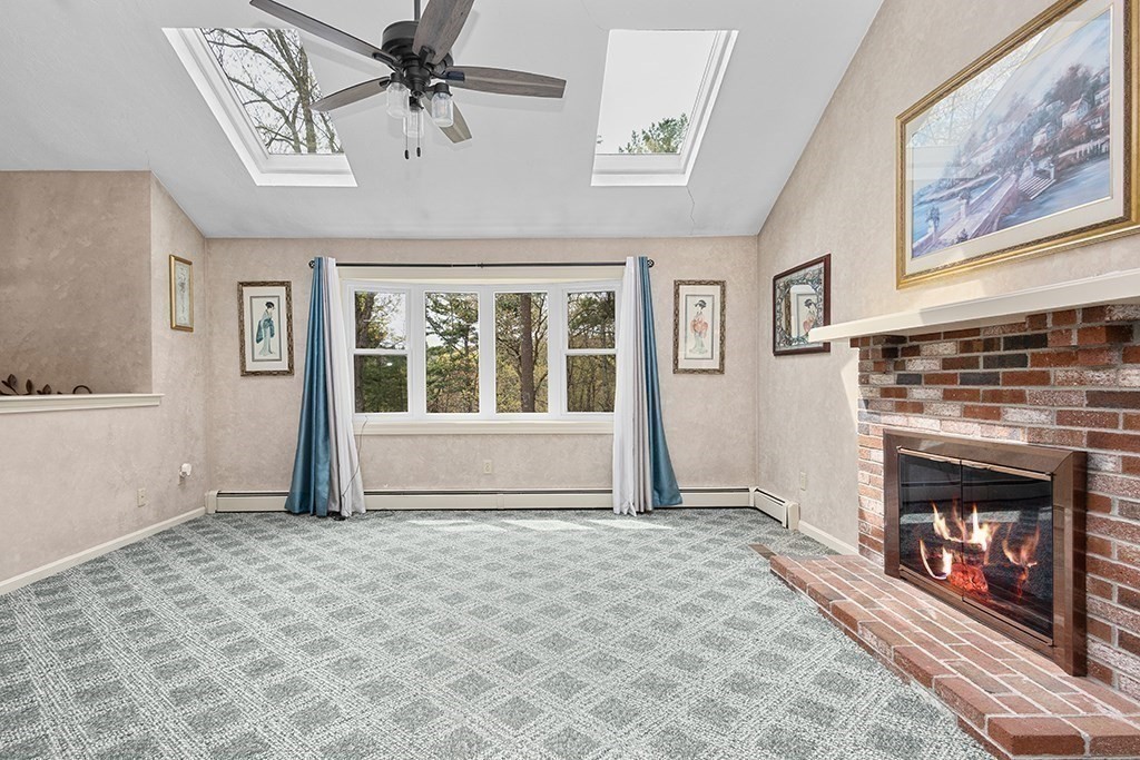 56 Leland Road Norfolk, MA 02056 - Photo 16 of 28 a view of a livingroom with a fireplace and window