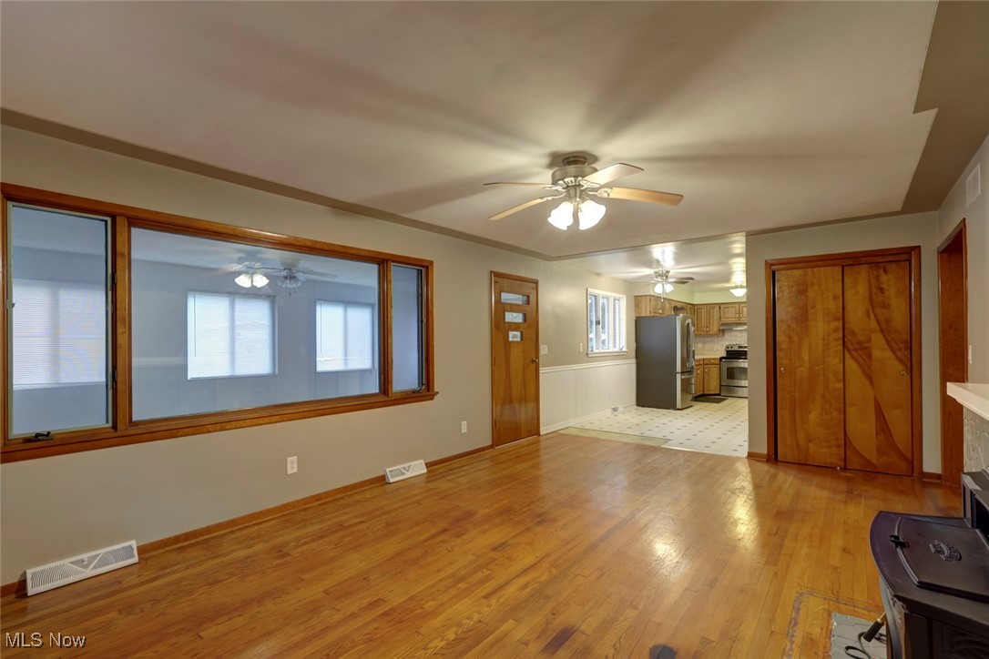 8104 Barnes Road Vermilion, OH 44089 - Photo 9 of 40 Unfurnished living room with light hardwood flooring