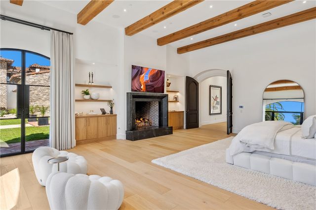 a bedroom with a bed and a fireplace