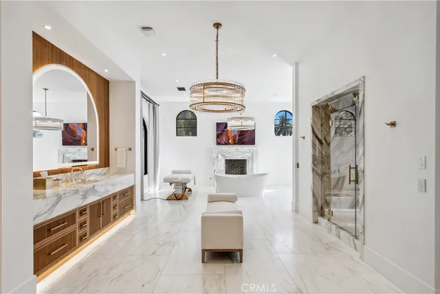 a view of a hallway with entryway windows and cabinet